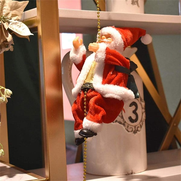 🎄Elektryczna zabawka muzyczna przedstawiająca Świętego Mikołaja wspinającego się po kominie